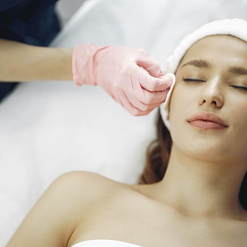 A woman getting a facial peel